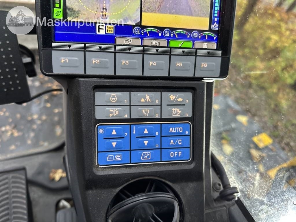 Pelle sur pneus Komatsu PW 148-11 med vagn och redskap: photos 25 Pelle sur pneus Komatsu PW 148-11 med vagn och redskap: photos 25