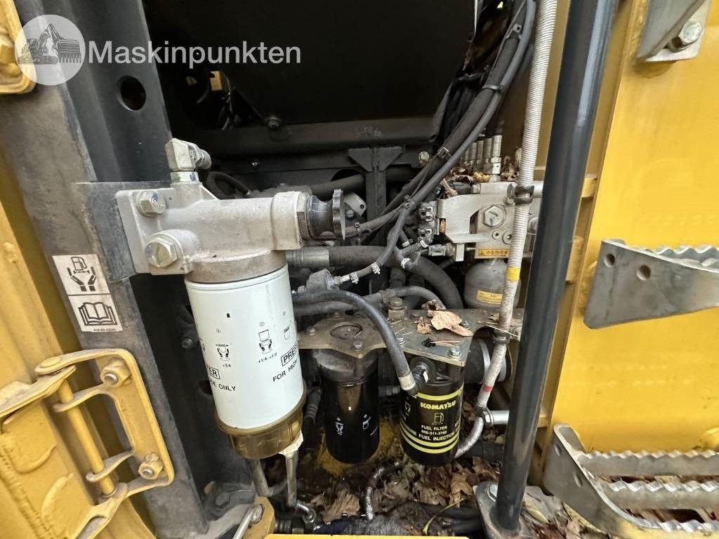 Pelle sur pneus Komatsu PW 148-11 med vagn och redskap: photos 46 Pelle sur pneus Komatsu PW 148-11 med vagn och redskap: photos 46