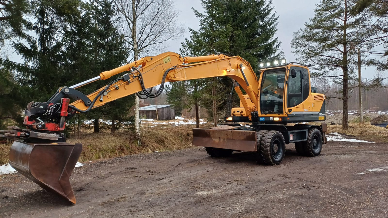 Hyundai Robex 140W-9A - Pelle sur pneus: photos 1 Hyundai Robex 140W-9A - Pelle sur pneus: photos 1