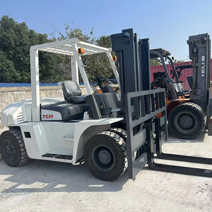 High Quality TCM 7 Ton with Hydraulic Distance Adjustment Used Forklift in Stock Used tcm Forklift 7 Ton Used tcm Fd70 Forklift - Chariot élévateur: photos 1 High Quality TCM 7 Ton with Hydraulic Distance Adjustment Used Forklift in Stock Used tcm Forklift 7 Ton Used tcm Fd70 Forklift - Chariot élévateur: photos 1