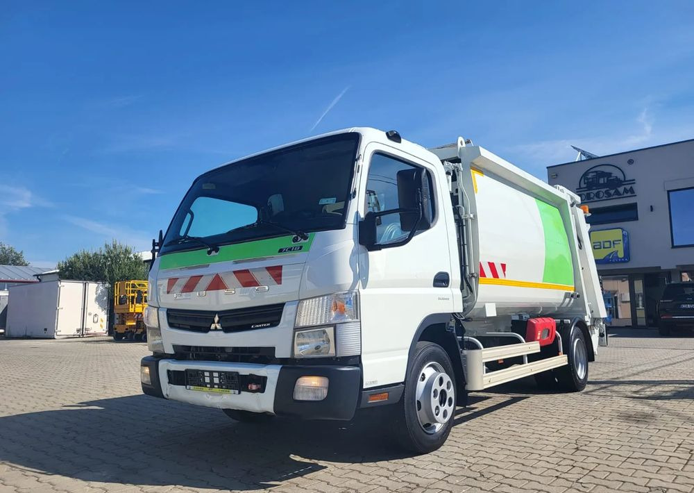 Mitsubishi Fuso Canter - Benne à ordures ménagères: photos 1 Mitsubishi Fuso Canter - Benne à ordures ménagères: photos 1
