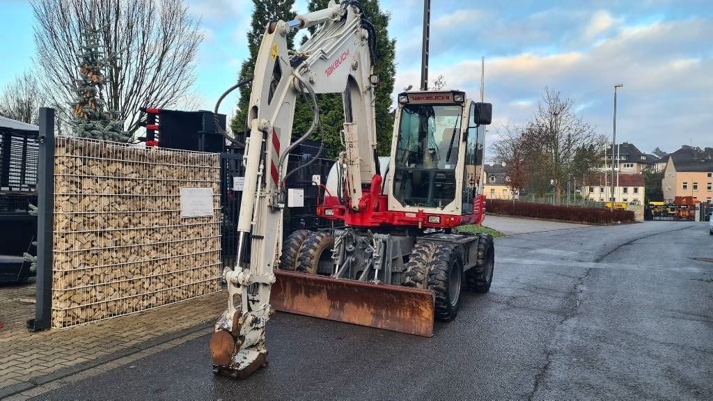 Pelle sur pneus Takeuchi TB 295 W, Powertilt, Schnellwechsler MS08, Klima: photos 23 Pelle sur pneus Takeuchi TB 295 W, Powertilt, Schnellwechsler MS08, Klima: photos 23