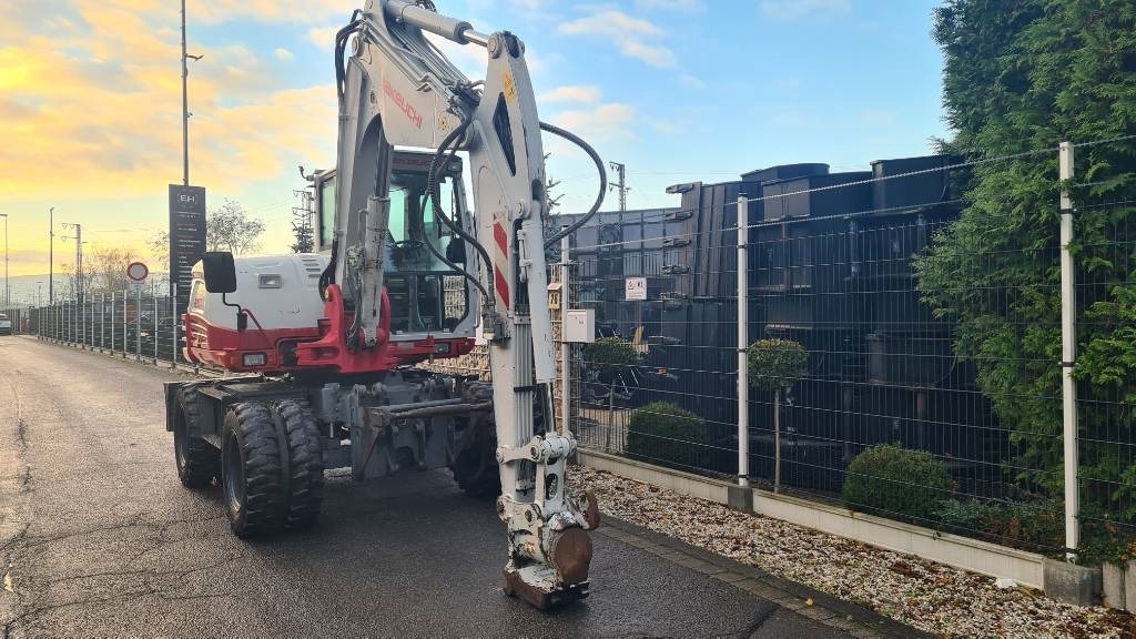 Pelle sur pneus Takeuchi TB 295 W, Powertilt, Schnellwechsler MS08, Klima: photos 18 Pelle sur pneus Takeuchi TB 295 W, Powertilt, Schnellwechsler MS08, Klima: photos 18