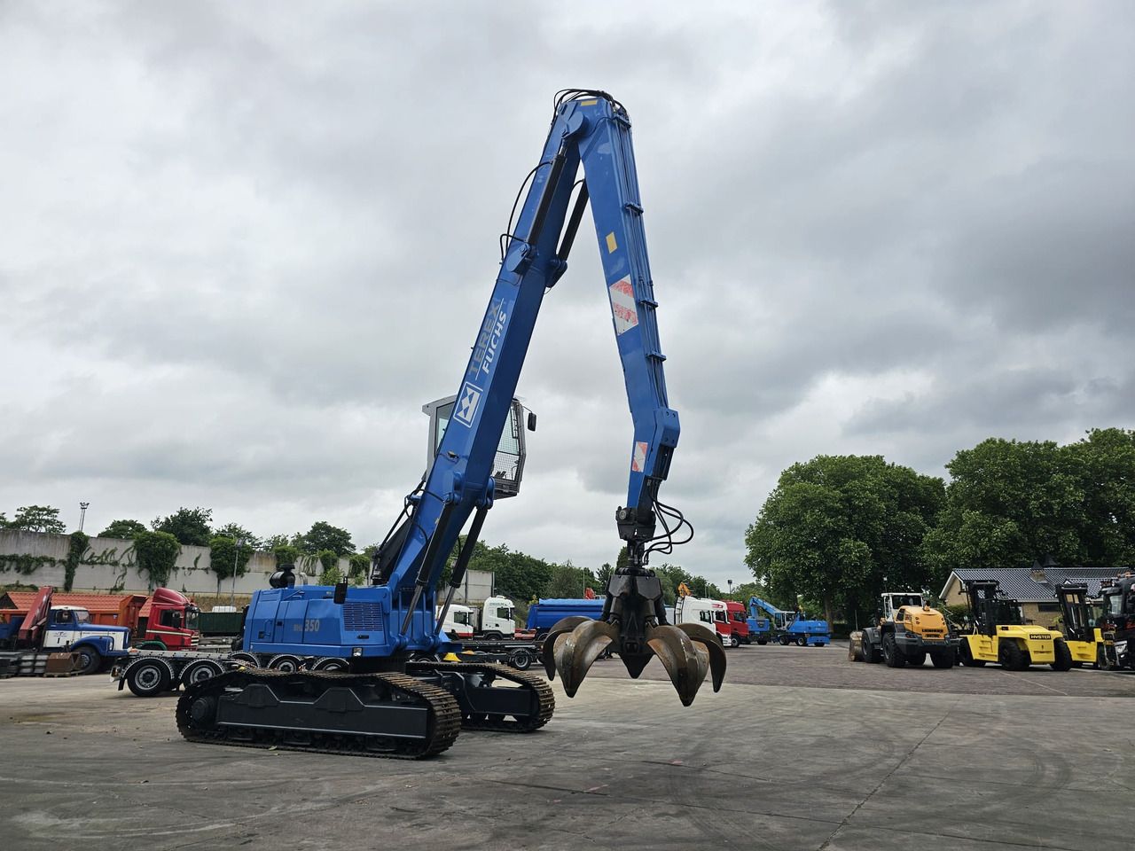 Pelle de manutention Fuchs RHL 350 Materialhandler With Adjustable Tracks: photos 6