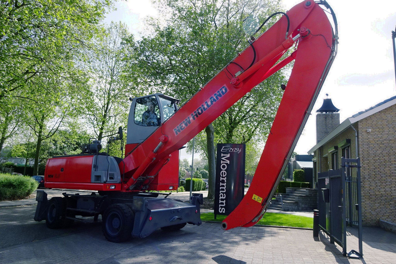 New Holland MH 6.6 With Multi Purpose Stick And Magnet System - Pelle de manutention: photos 1 New Holland MH 6.6 With Multi Purpose Stick And Magnet System - Pelle de manutention: photos 1