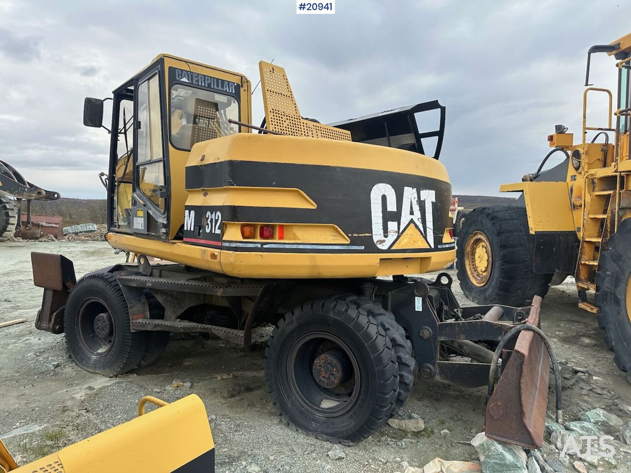 Caterpillar 312 - Pelle sur pneus: photos 5 Caterpillar 312 - Pelle sur pneus: photos 5