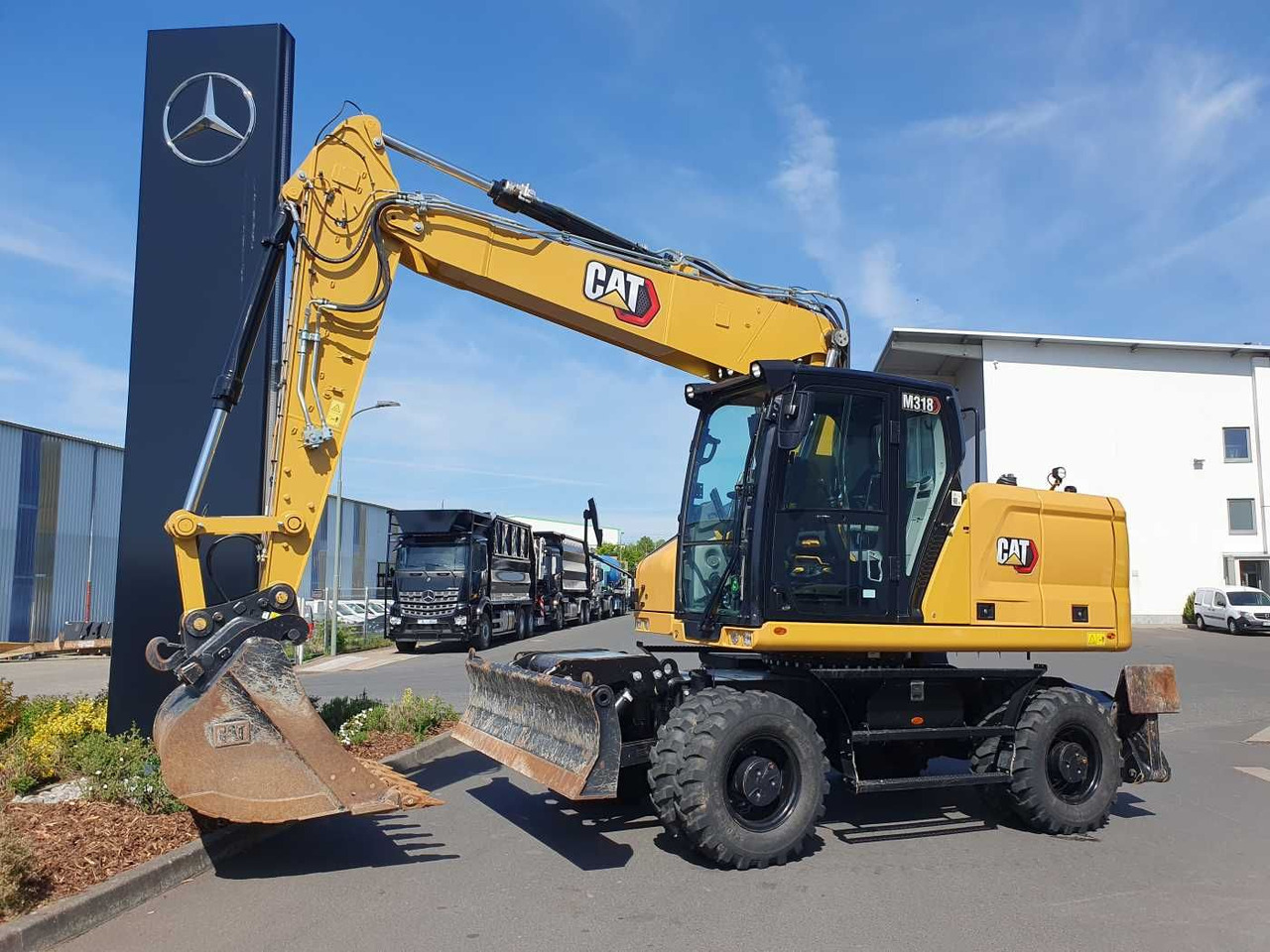 CAT M318 / 2022 / nur 286h! / Tieflöffel / Pratzen - Pelle sur pneus: photos 1 CAT M318 / 2022 / nur 286h! / Tieflöffel / Pratzen - Pelle sur pneus: photos 1