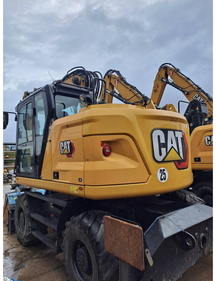 Pelle sur pneus CAT M315: photos 15