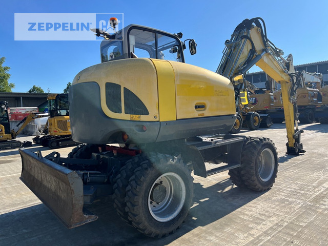 Neuson EW100 - Pelle sur pneus: photos 5 Neuson EW100 - Pelle sur pneus: photos 5